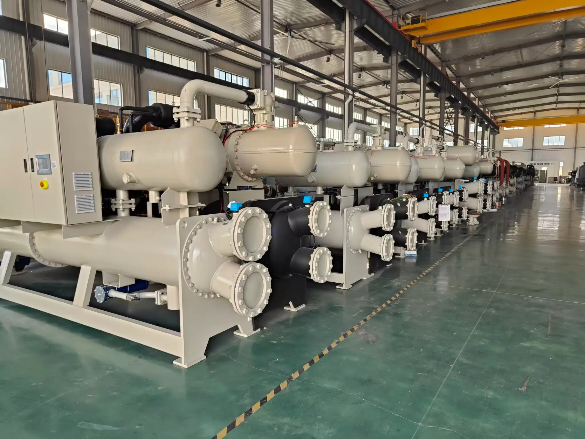 Finished water cooled screw chiller production line in an industrial manufacturing facility